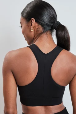 Sujetador deportivo negro cremallera central SEAMLESS FIT